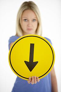 Woman Holding Road Traffic Sign