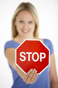 Woman Holding Road Traffic Sign
