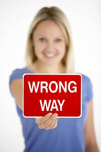 Woman Holding Road Traffic Sign
