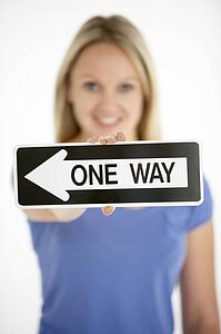 Woman Holding Road Traffic Sign