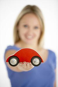 Woman Holding Toy Car