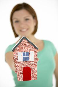 Woman Holding Model House