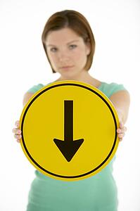 Woman Holding Road Traffic Sign