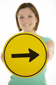 Woman Holding Road Traffic Sign