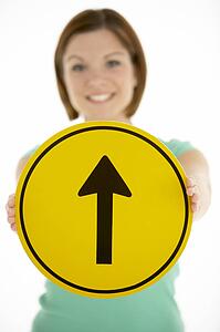 Woman Holding Road Traffic Sign