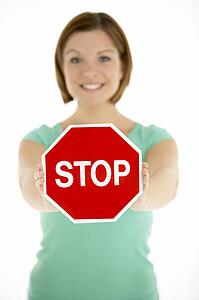 Woman Holding Road Traffic Sign
