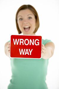 Woman Holding Road Traffic Sign