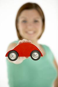 Woman Holding Toy Car