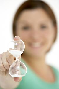 Woman Holding Hourglass