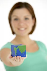 Woman Holding Cube Shaped Globe