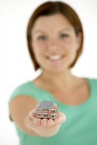 Woman Holding Model House