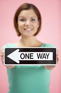 Woman Holding Road Traffic Sign