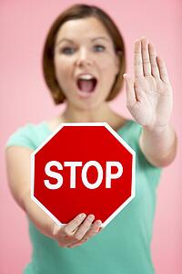 Woman Holding Road Traffic Sign