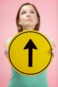 Woman Holding Road Traffic Sign