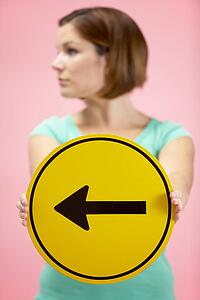 Woman Holding Road Traffic Sign