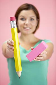Woman Holding Big Pencil And Eraser