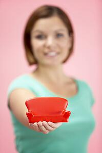 Woman Holding Small Sofa