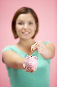 Woman Holding Piggy Bank