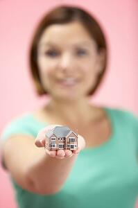 Woman Holding Model House