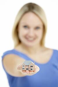 Woman Holding Model House
