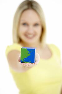 Woman Holding Cube Shaped Globe