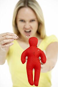 Woman Holding Voodoo Doll