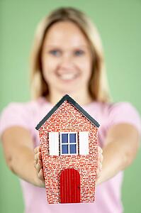 Woman Holding Model House