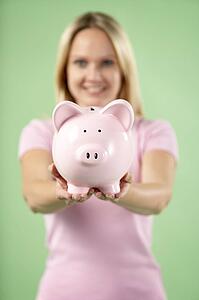 Woman Holding Piggy Bank