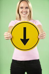 Woman Holding Road Traffic Sign