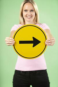 Woman Holding Road Traffic Sign