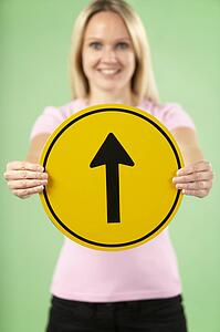 Woman Holding Road Traffic Sign