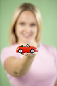 Woman Holding Toy Car