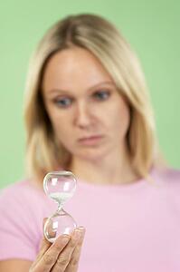Woman Holding Hourglass