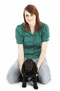 Girl With Black Spaniel Puppy