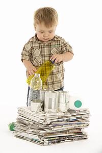 Young Boy Recycling In Studio