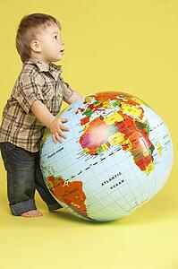 Toddler In Studio With Globe