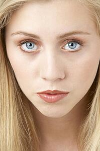 Portrait Of Young Woman Looking At Camera