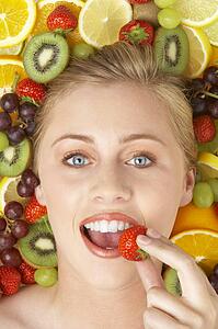 Portrait Of Young Woman Eating Strawberry