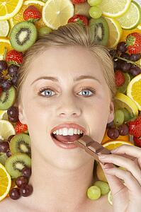 Portrait Of Young Woman Eating Chocolate