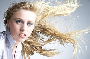 Young Woman With Hair Blowing Behind