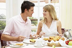 Young Couple Enjoying Hotel Breakfast