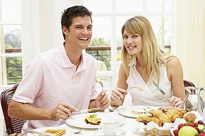 Middle Aged Couple Enjoying Hotel Breakfast