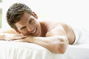 Young Man Relaxing On Massage Table