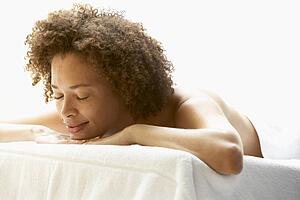Young Woman Relaxing On Massage Table
