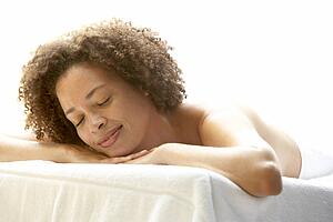 Young Woman Relaxing On Massage Table