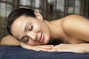 Young Woman Relaxing On Massage Table