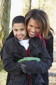 Mother And Son On Autumn Walk