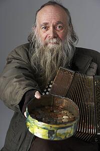 Senior Man Busking With Accordian