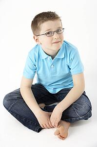 Young Boy Sitting In Studio