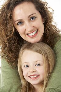Portrait Of Cuddling Mother And Child